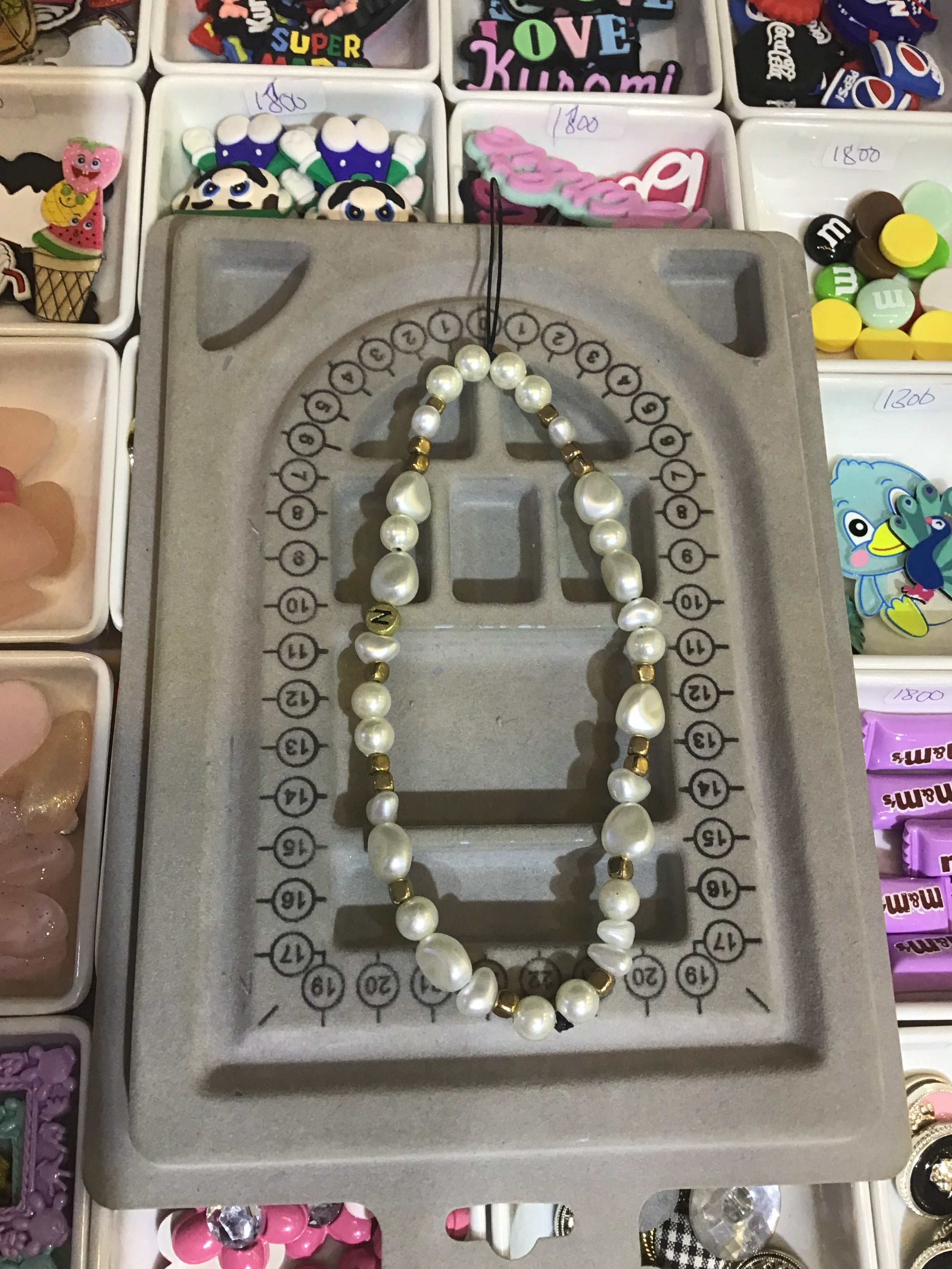 White & gold pearl charm