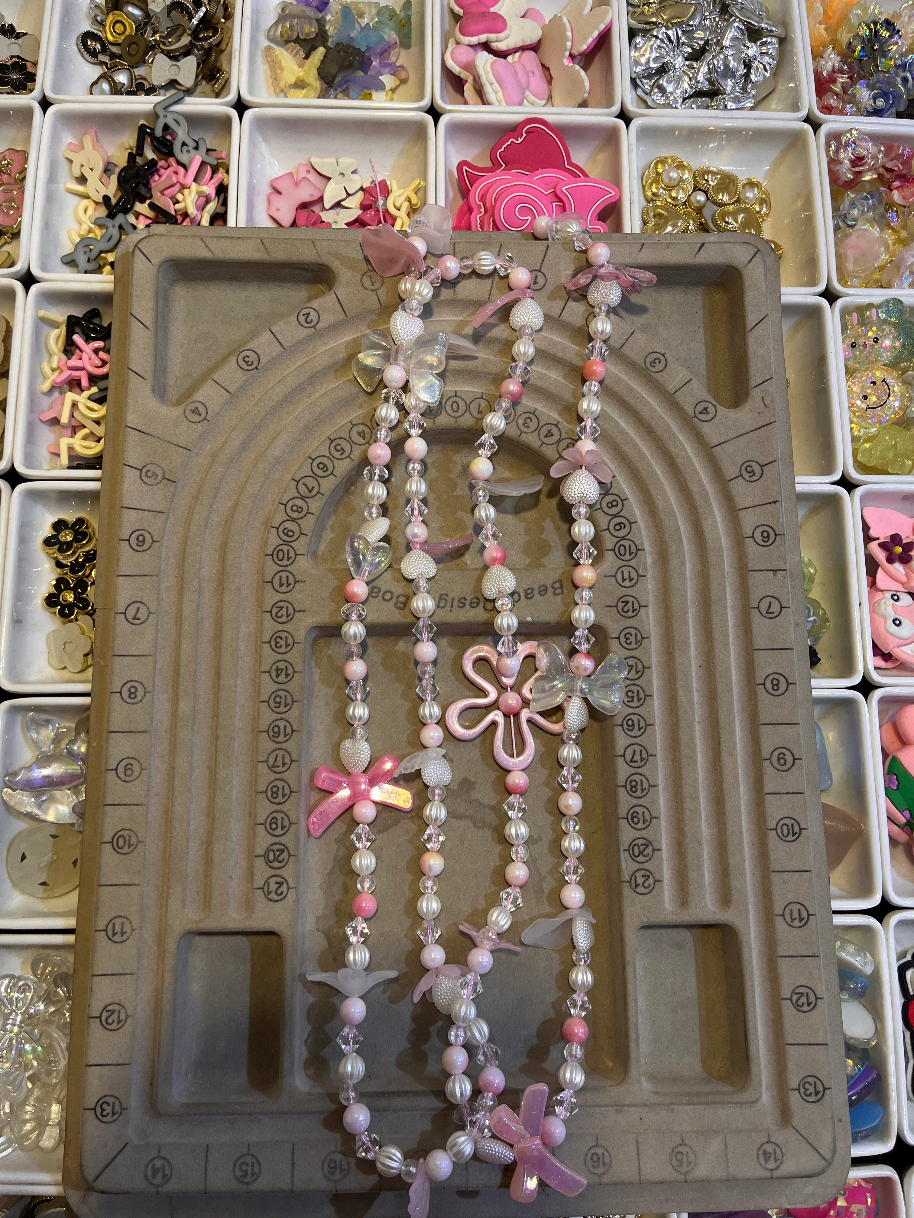 Long pink phone charm