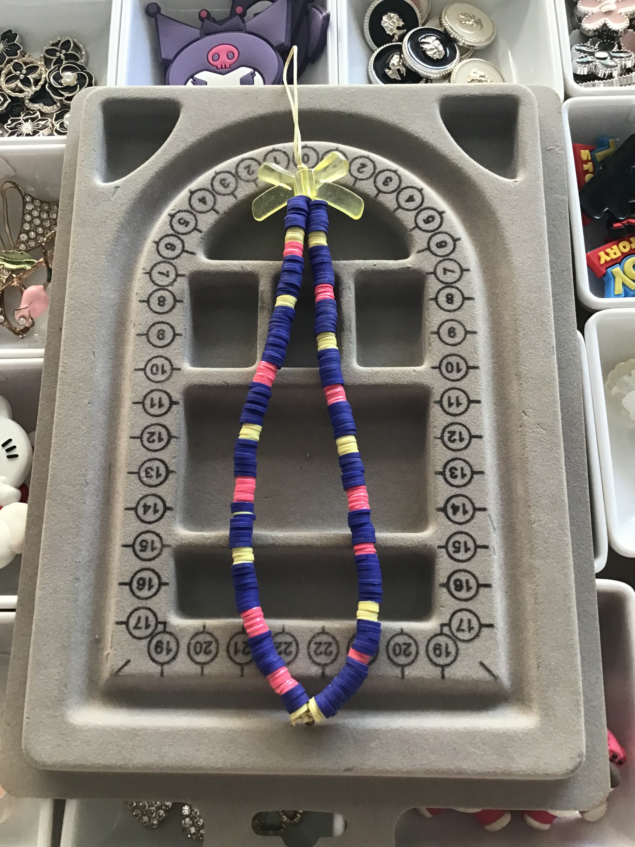 Blue,yellow & pink with yellow bow phone charm