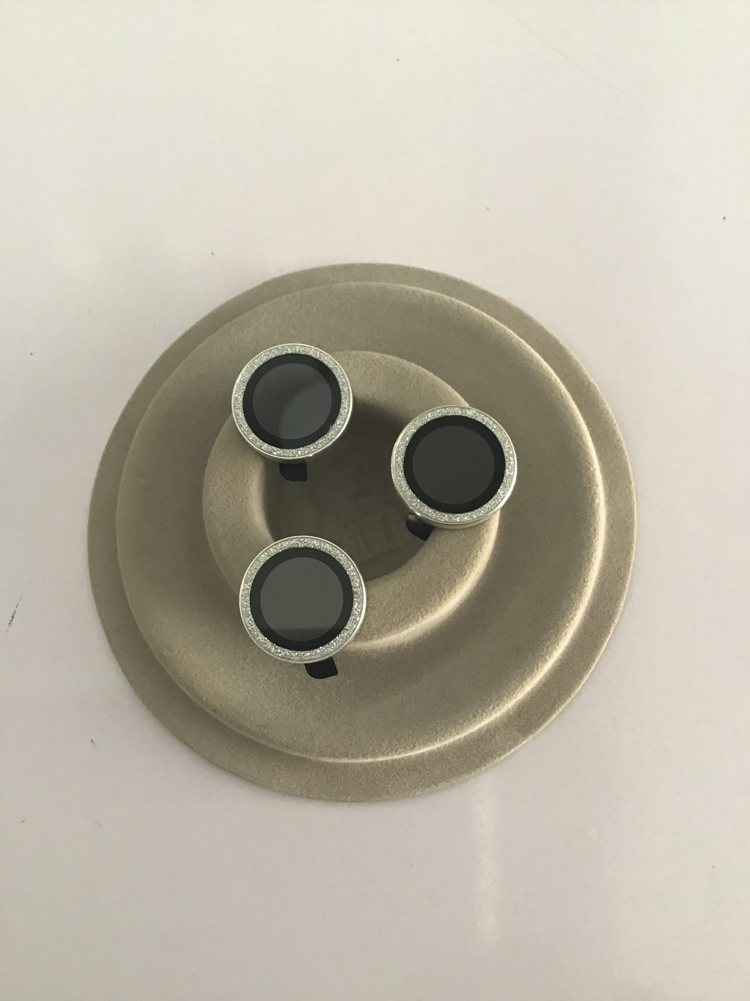 Shiny silver camera lens